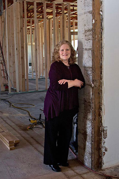 Woman standing in remodel project