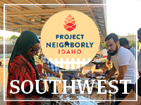 Background: BBQ/Pot Luck type gathering around a table with food options - Caption: Project Neighborly Idaho: Southwest