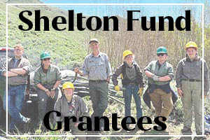 Background: Group of people doing work outdoors. Caption: Shelton Fund Grantees